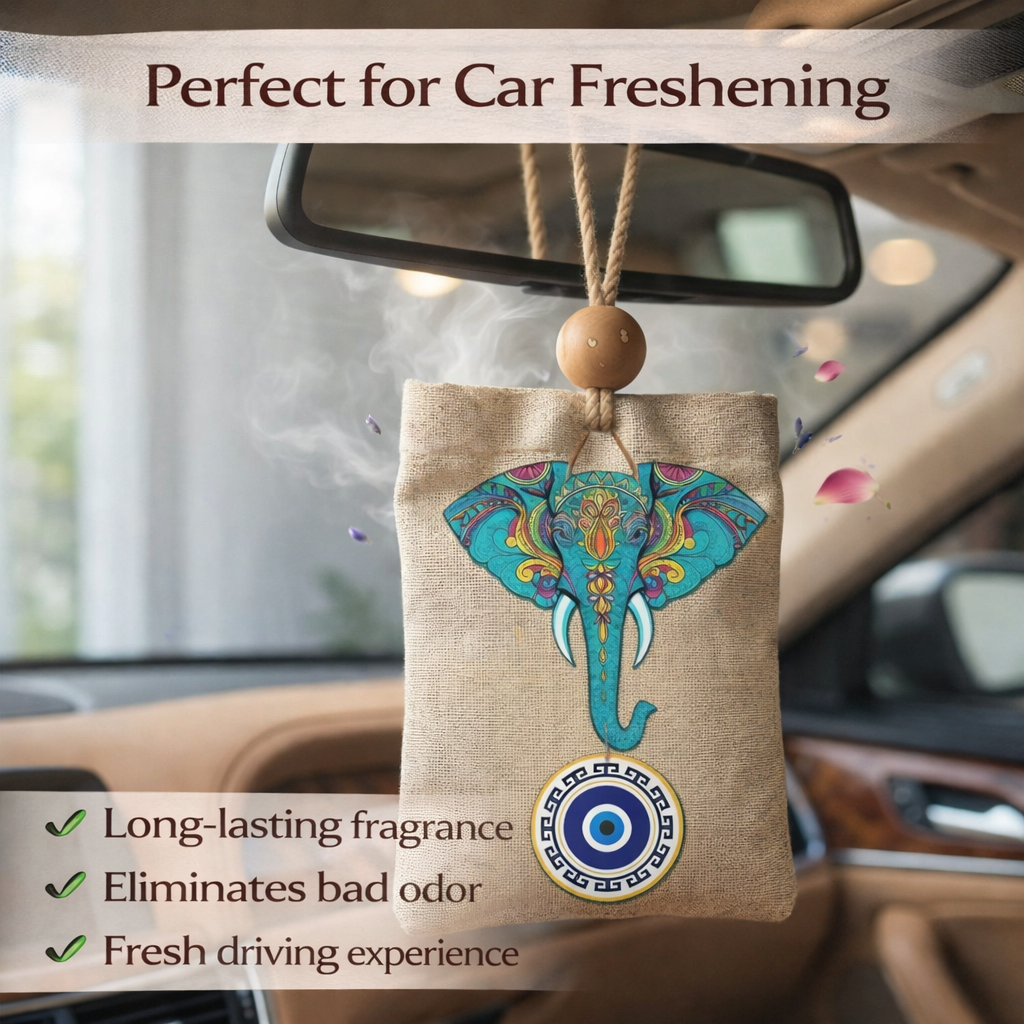 Car air freshener with elephant design hanging from a car's rearview mirror.