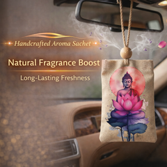Car air freshener with Buddha and lotus design hanging from a car's rearview mirror.